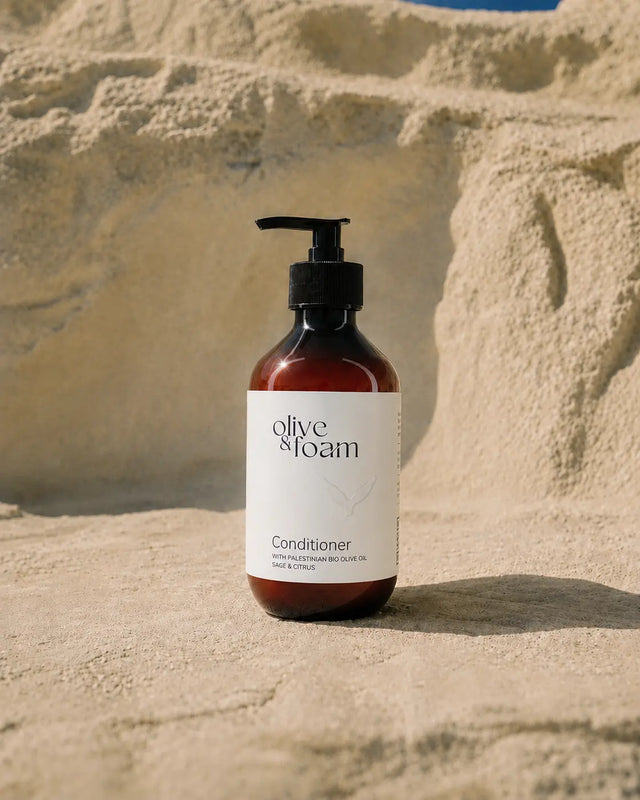 Olive & Foam Conditioner Sage & Citrus lifestyle shot — Palestinian olive oil hair care UAE