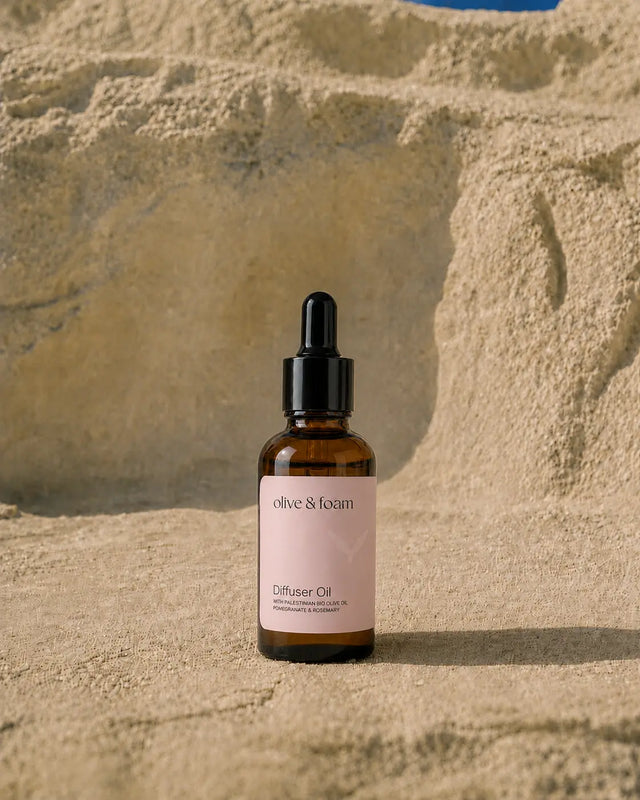Olive & Foam Pomegranate & Rosemary Diffuser Oil lifestyle shot — home fragrance UAE