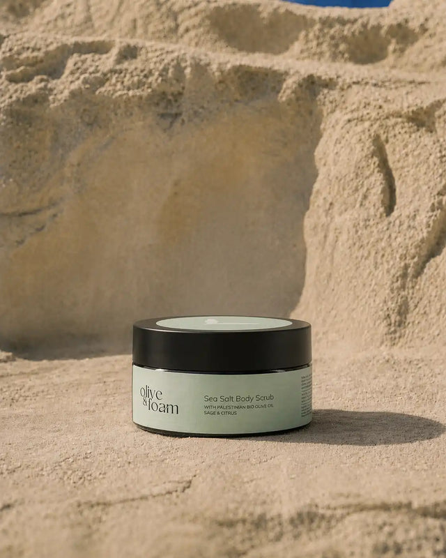 Olive & Foam Sea Salt Body Scrub lifestyle — exfoliating sea salt texture